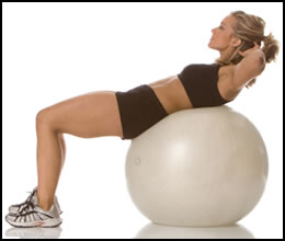 6 Best Ab Exercises- Exercise ball crunches add instability so that your abs work harder to keep you balanced.