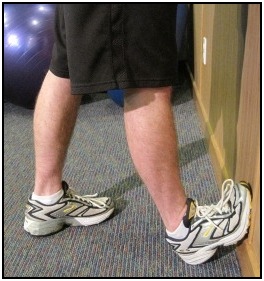 Standing calf stretch  with foot against the wall, position 2.