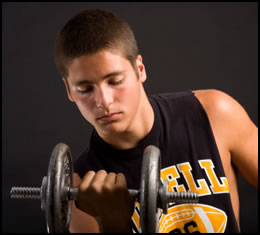 Weight training for teenagers should be done with free weights, like this guy's doing.