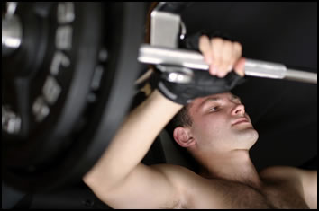 What is isometric exercise?  This guy is preparing to do an extended bench press isometric contraction, one example of isometric exercise.