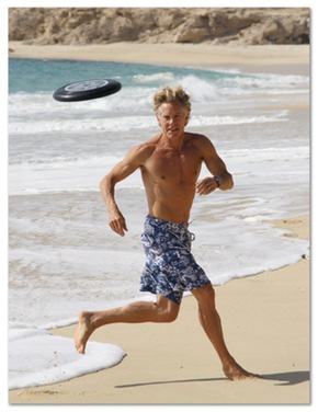 Mark Sisson playing on the beach, and looking good as a result of his primal diet.