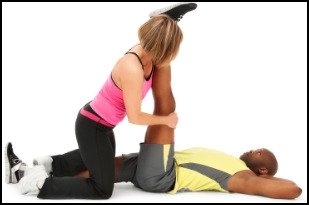 Increasing flexibility in the legs with the help of a partner in one use of PNF stretches.